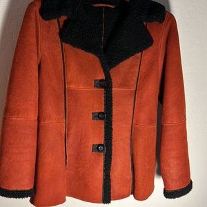 Rust and black shearling coat